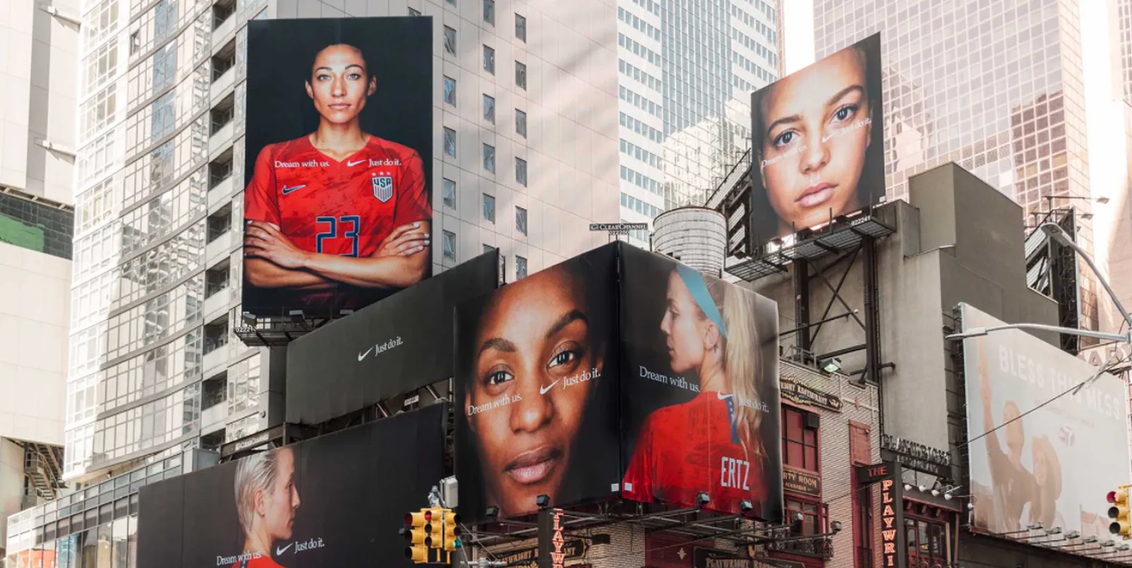Billboards showing faces on the side of buildings